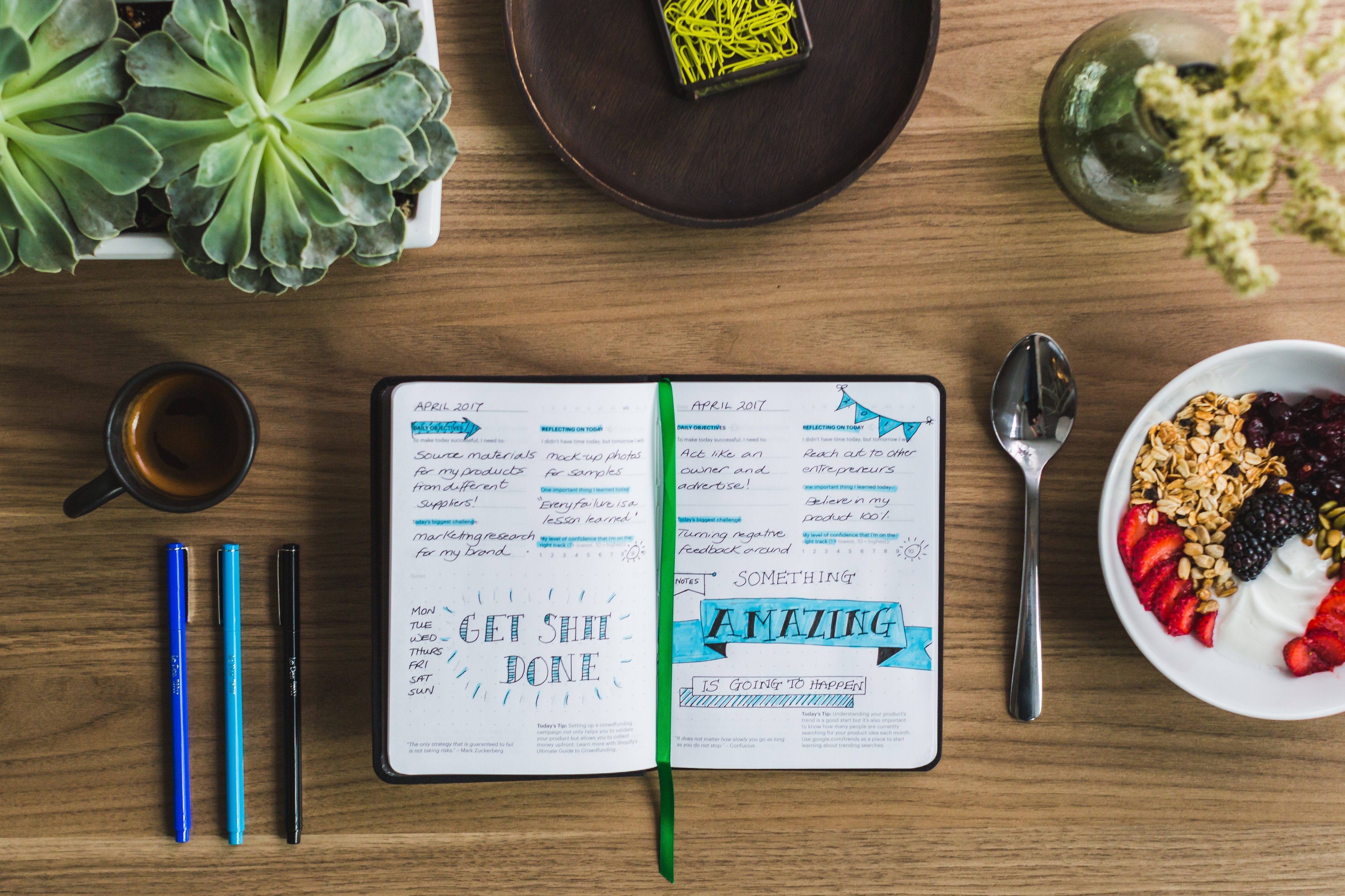 table, books, pens, and snacks ready for journaling